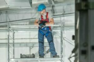 Professional HVAC Technician Worker on Scaffolding